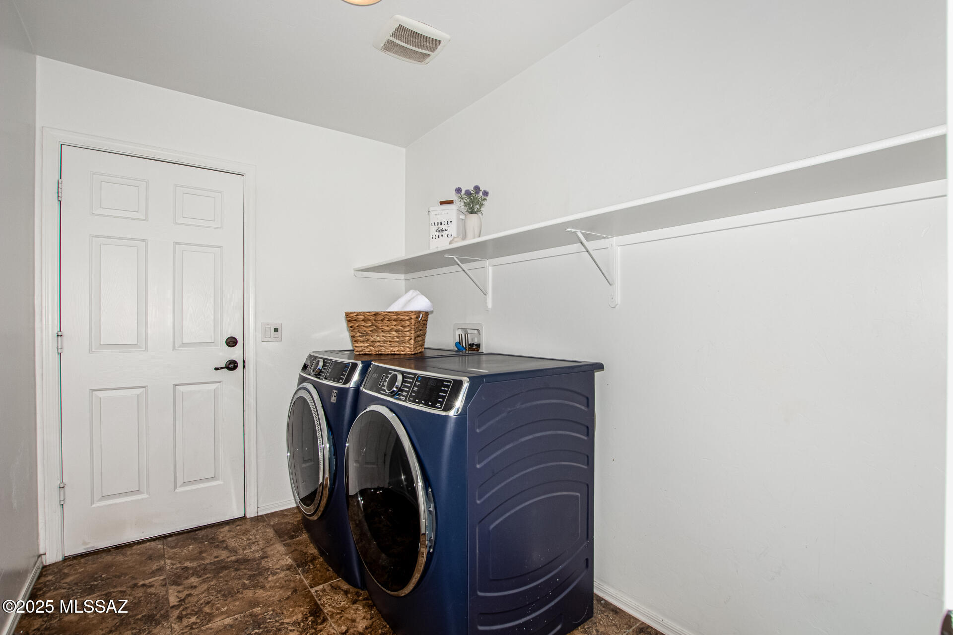 9528 Desert Fauna Loop Tucson, AZ 85747 - Photo 16 of 46 a utility room with dryer and washer