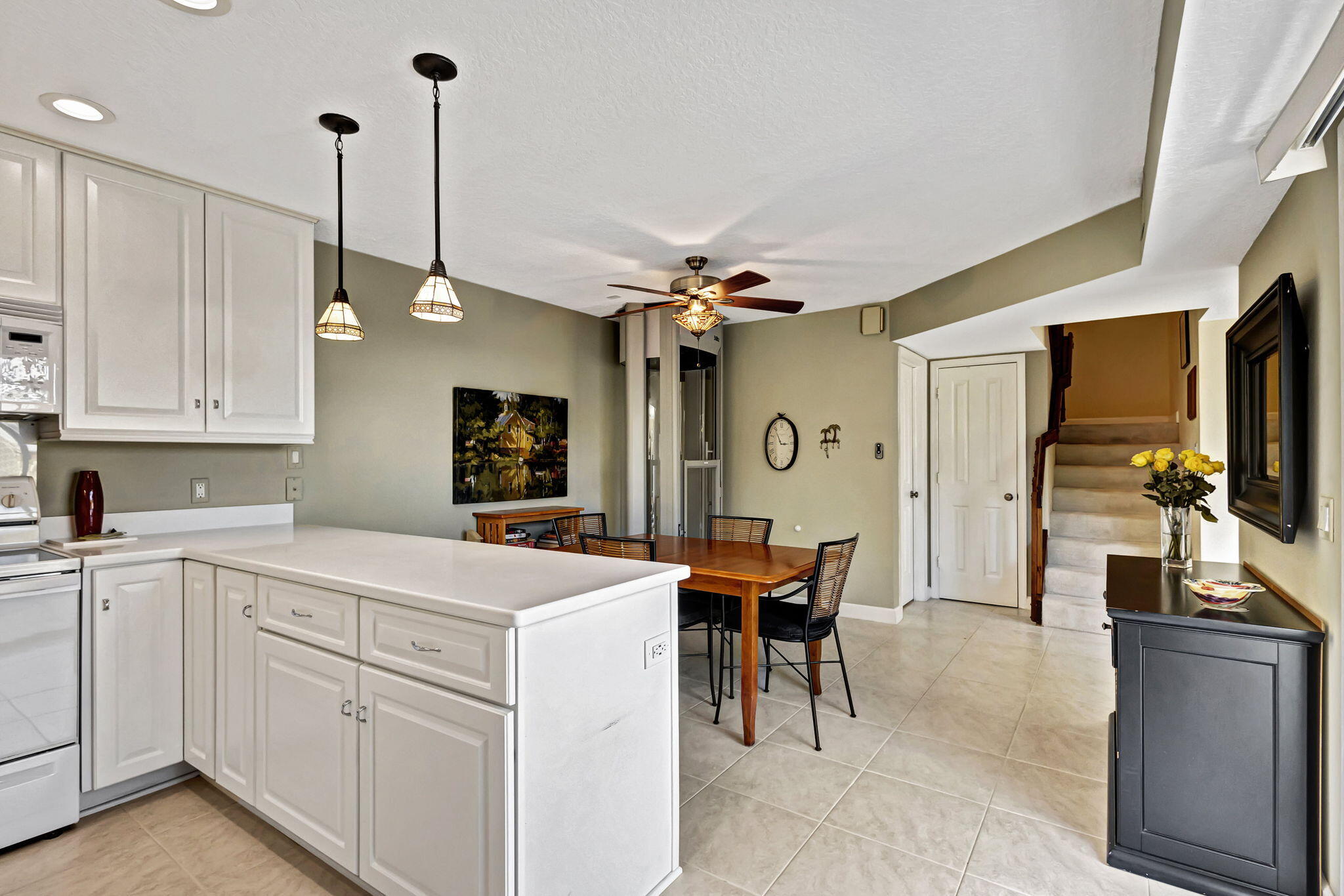 1420 Ocean Way, Unit 23B Jupiter, FL 33477 - Photo 11 of 37 a kitchen that has a cabinets and a stove