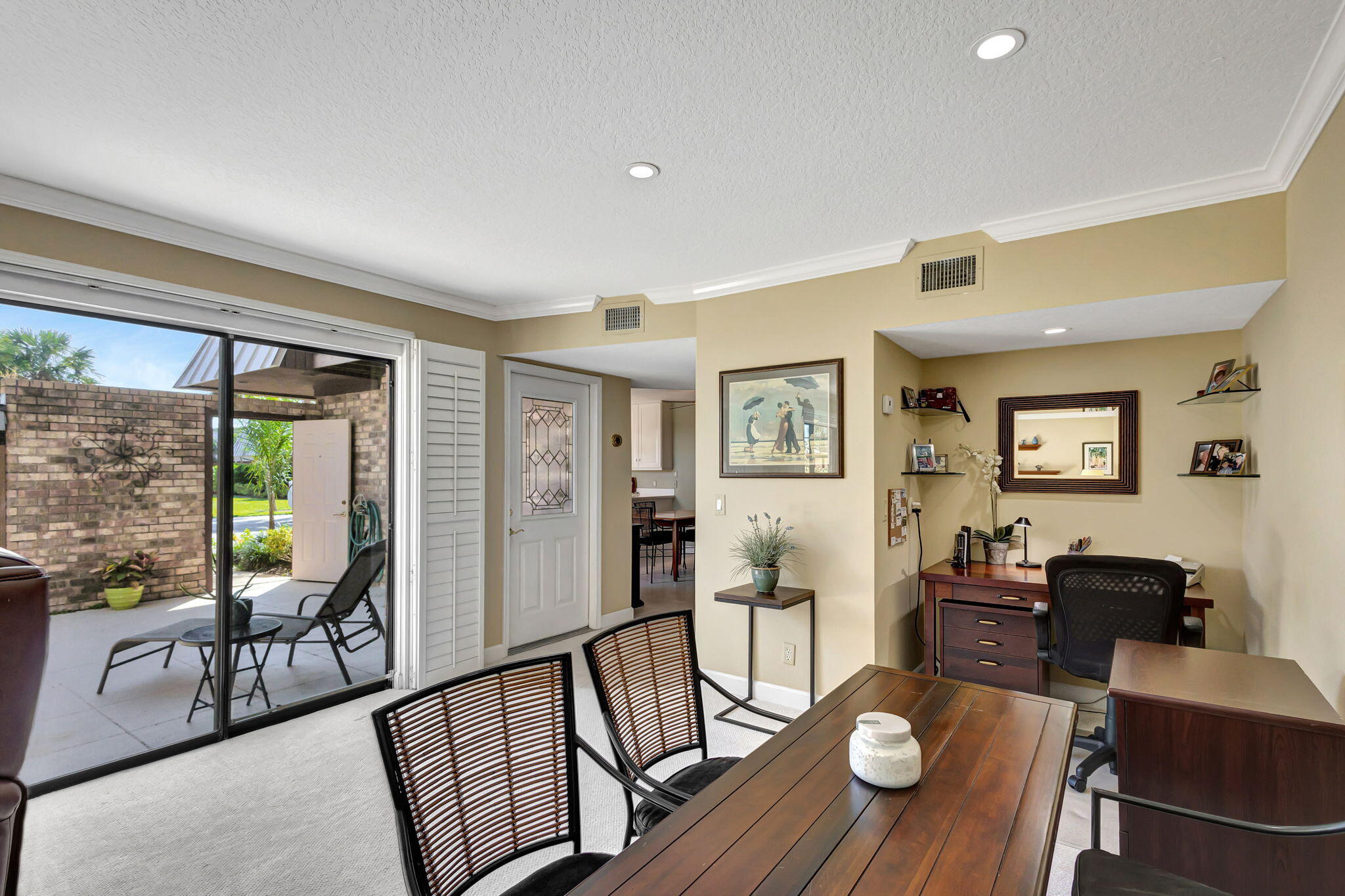 1420 Ocean Way, Unit 23B Jupiter, FL 33477 - Photo 18 of 37 a living room with furniture and a table