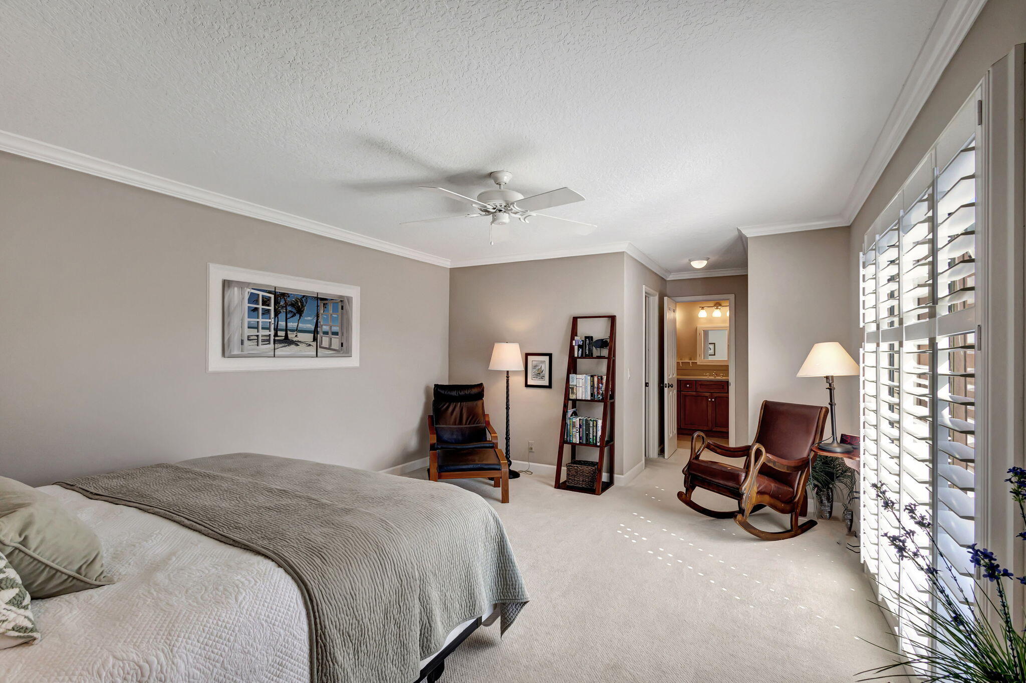 1420 Ocean Way, Unit 23B Jupiter, FL 33477 - Photo 21 of 37 a bedroom with bed a couch and a large window