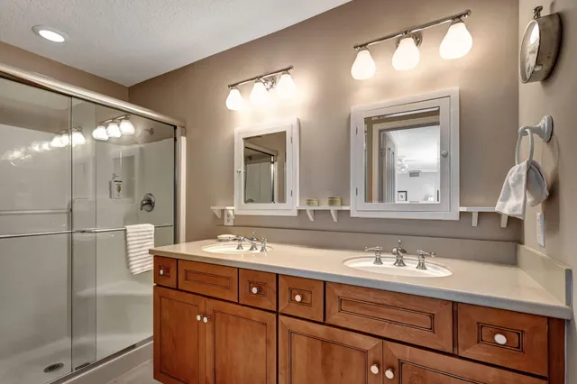 a bathroom with a sink double vanity and a mirror