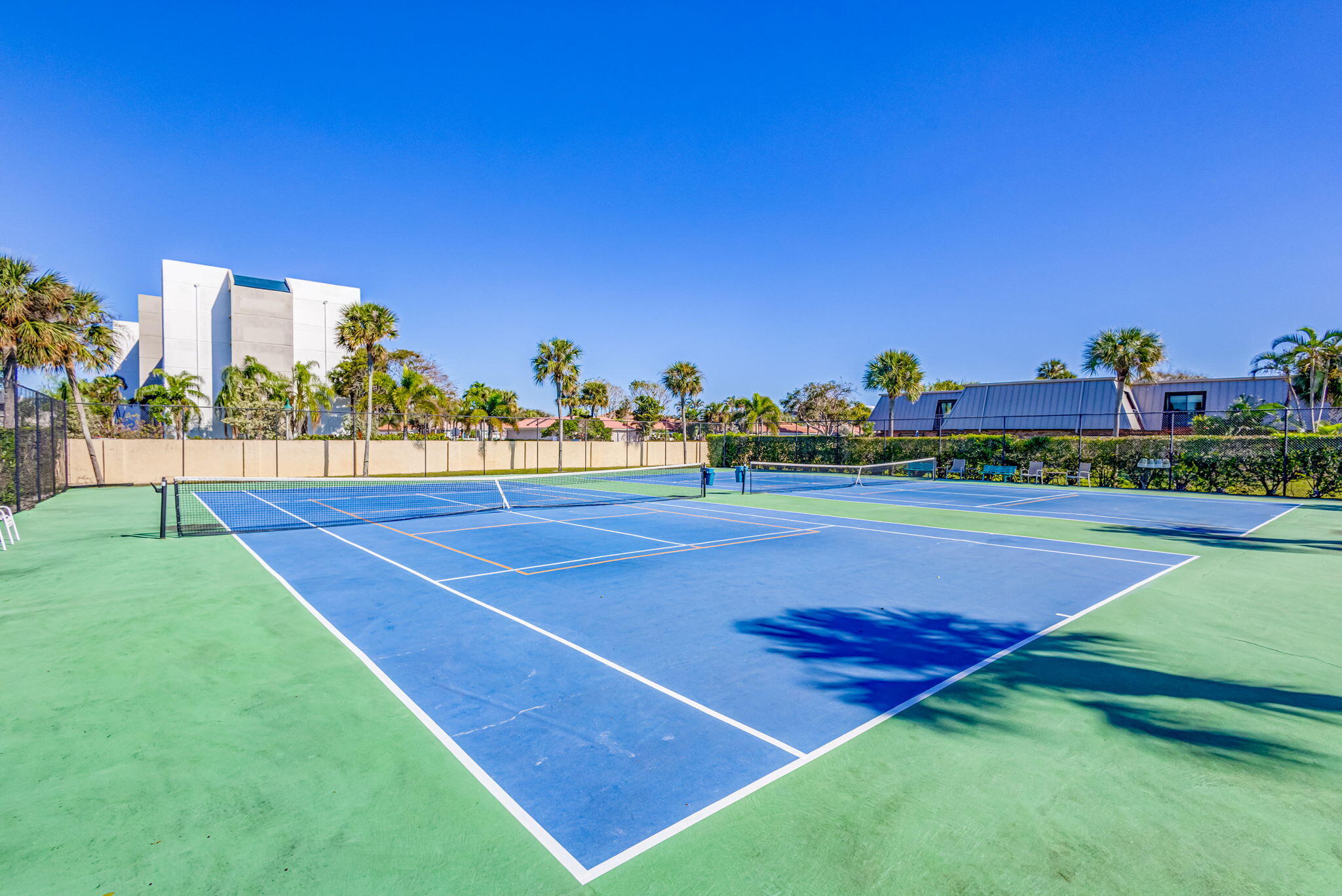 1420 Ocean Way, Unit 23B Jupiter, FL 33477 - Photo 34 of 37 a view of a tennis court