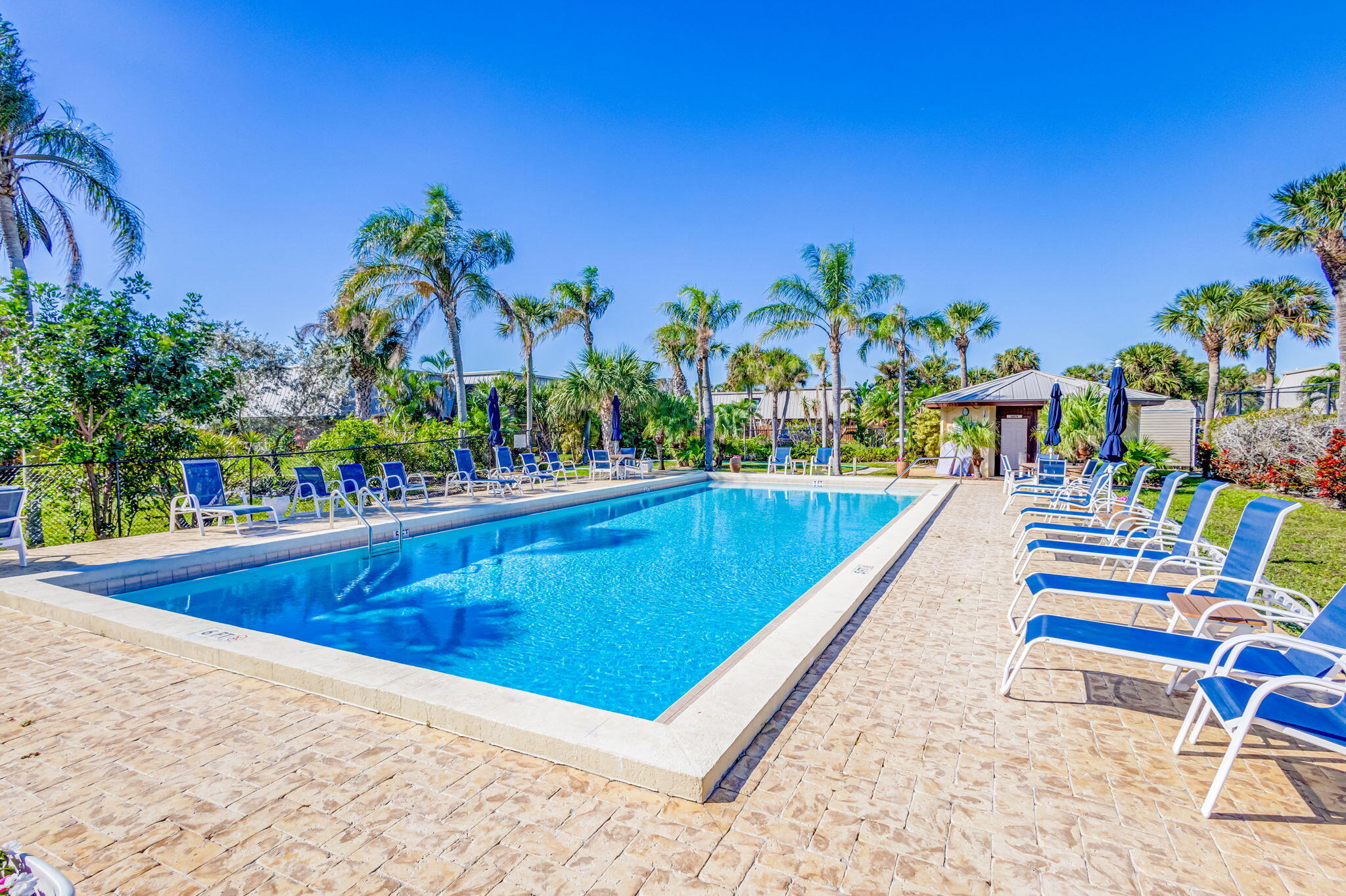 1420 Ocean Way, Unit 23B Jupiter, FL 33477 - Photo 35 of 37 a view of swimming pool with chairs