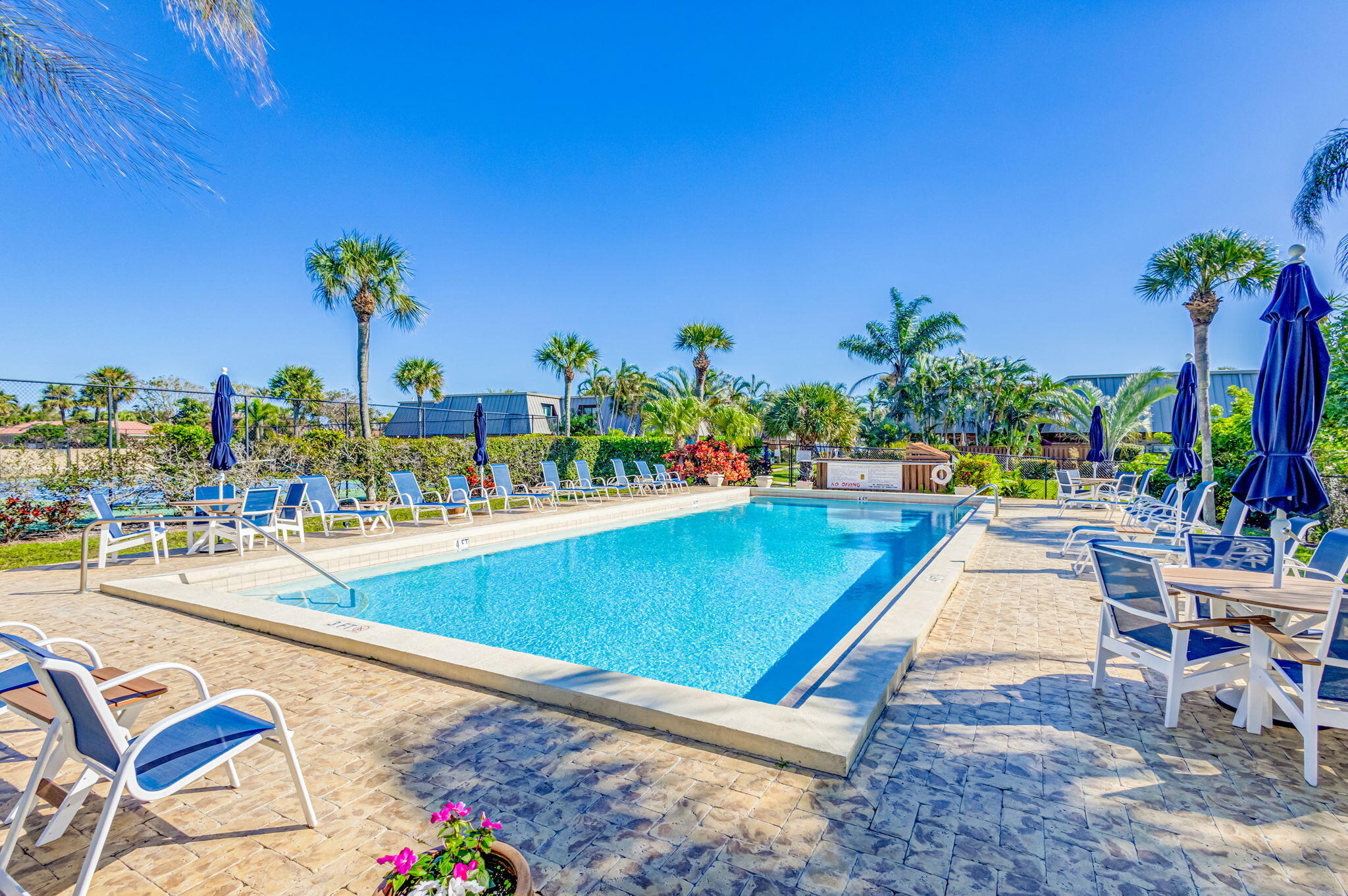 1420 Ocean Way, Unit 23B Jupiter, FL 33477 - Photo 36 of 37 a view of swimming pool with outdoor seating