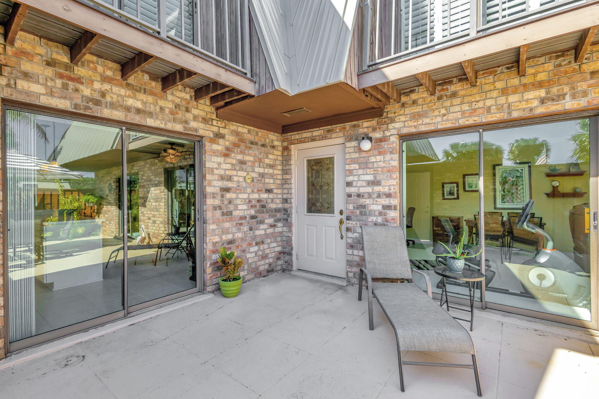 1420 Ocean Way, Unit 23B Jupiter, FL 33477 - Photo 7 of 37 a view of a building with sitting area