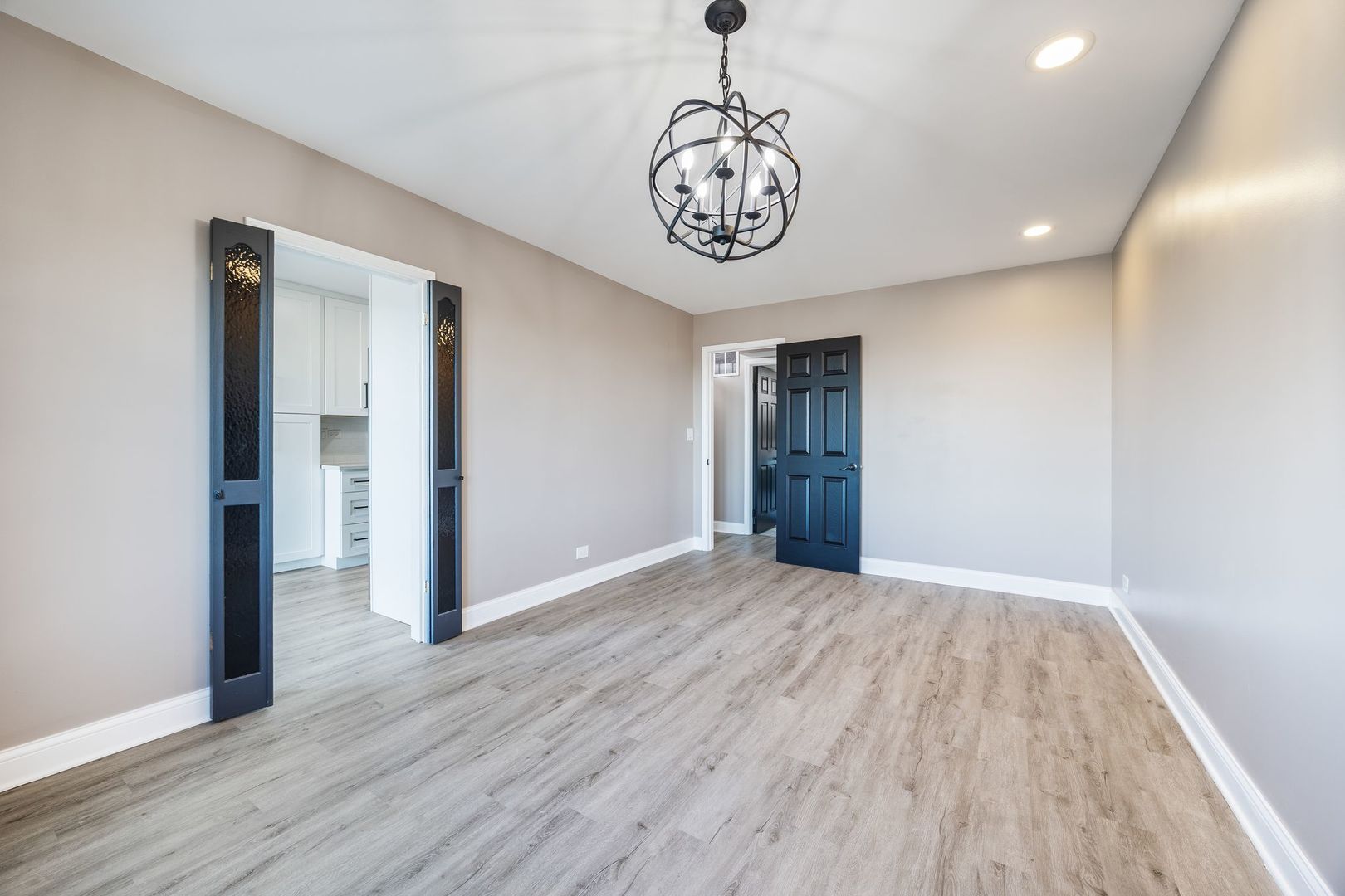 7730 Dempster Street, Unit 406 Morton Grove, IL 60053 - Photo 21 of 32 a view of an empty room with wooden floor