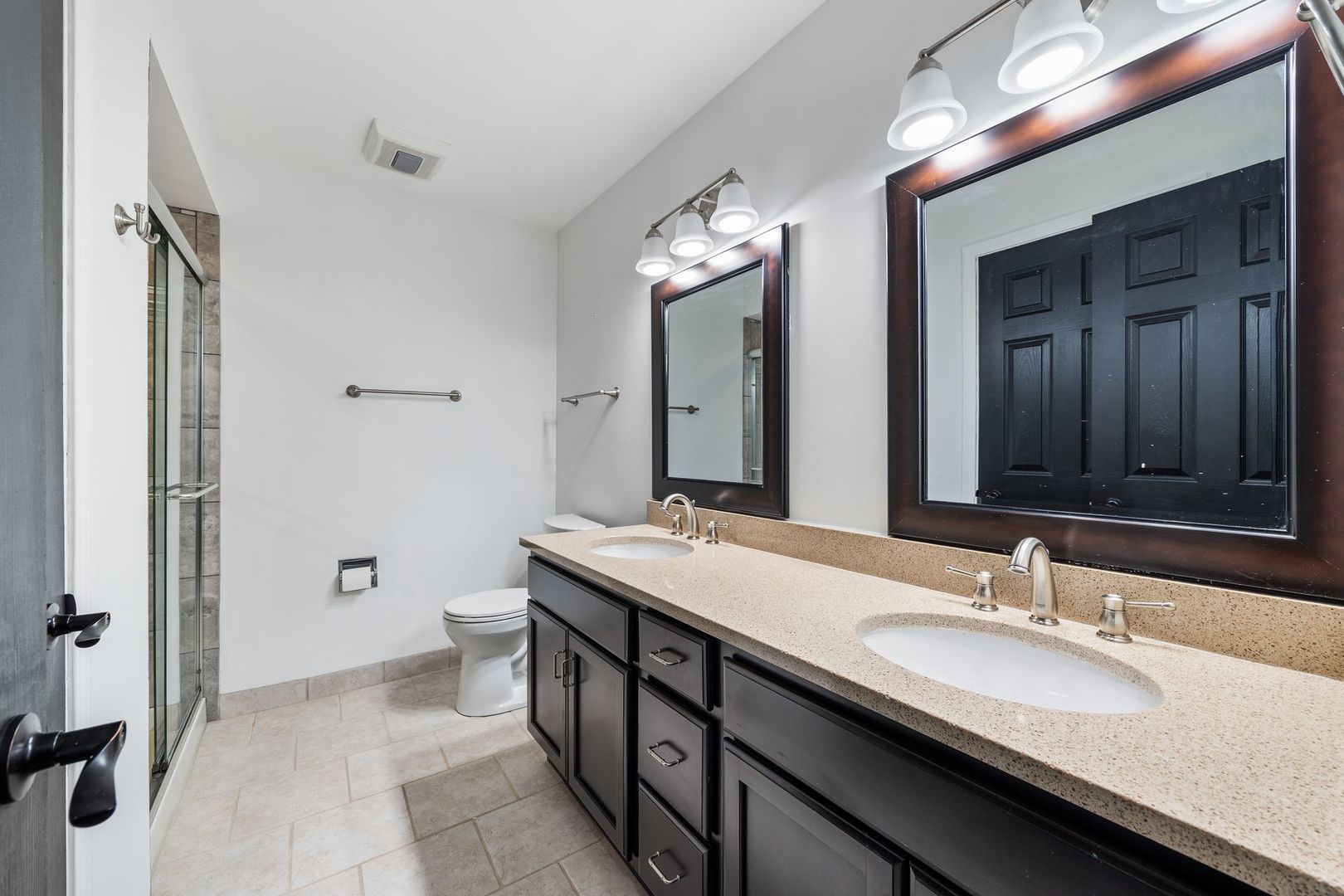 7730 Dempster Street, Unit 406 Morton Grove, IL 60053 - Photo 23 of 32 a bathroom with a double vanity sink and a mirror