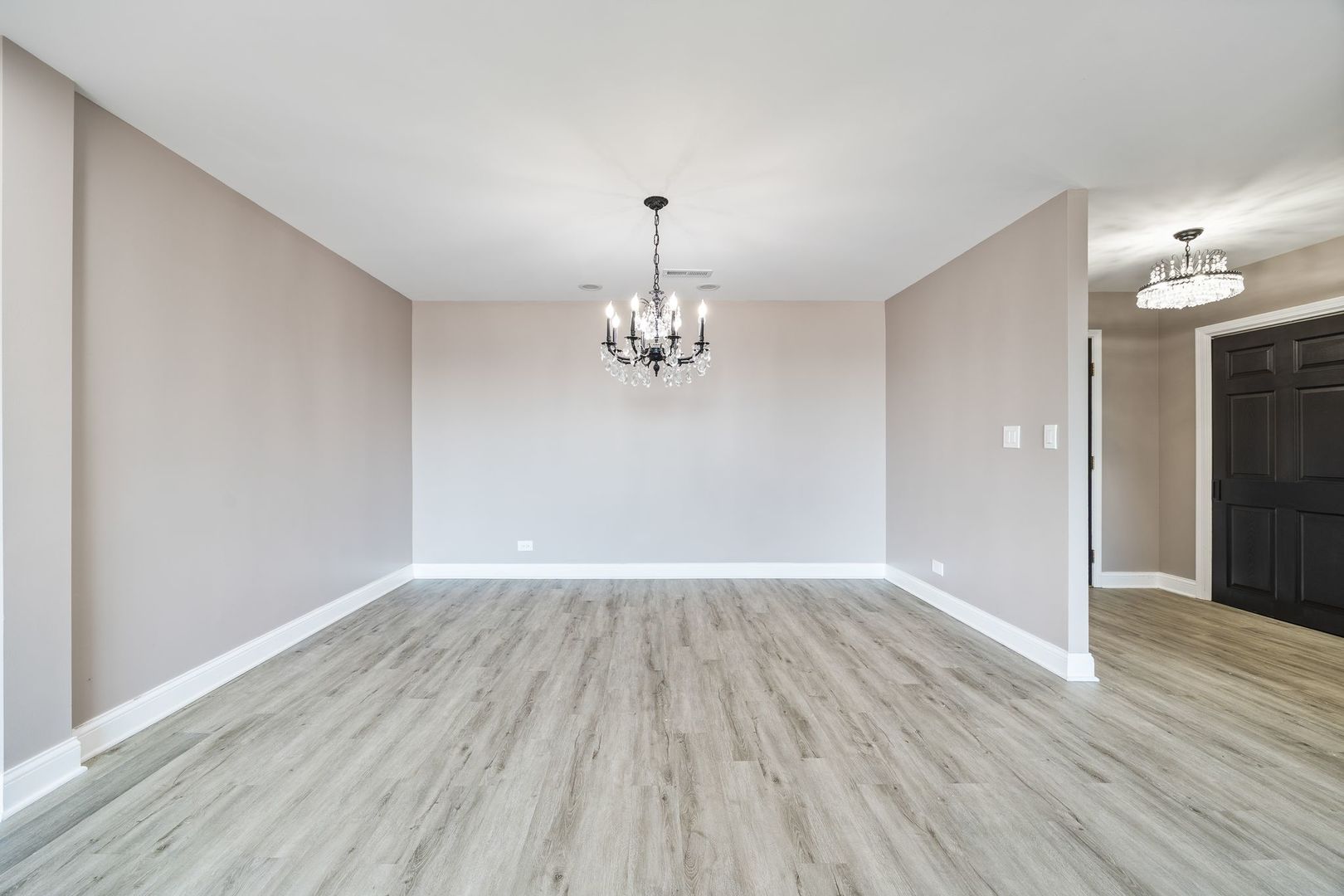 7730 Dempster Street, Unit 406 Morton Grove, IL 60053 - Photo 9 of 32 wooden floor in an empty room with a window