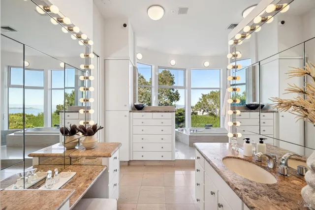 a view of a kitchen counter space a sink and living room view