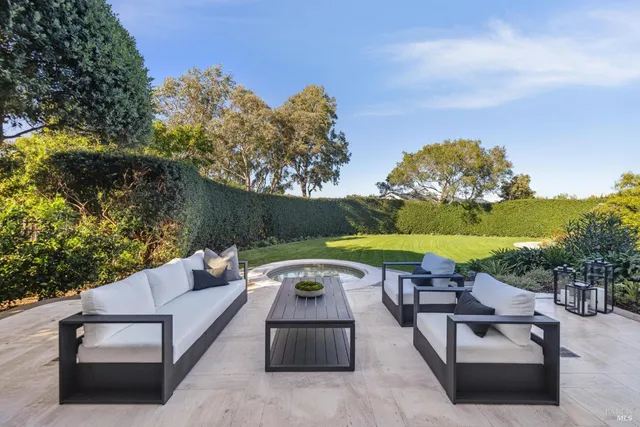 a view of a swimming pool with a yard