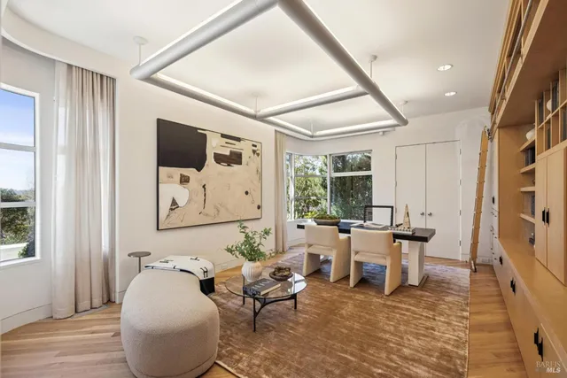 a bedroom with a bed and a large mirror