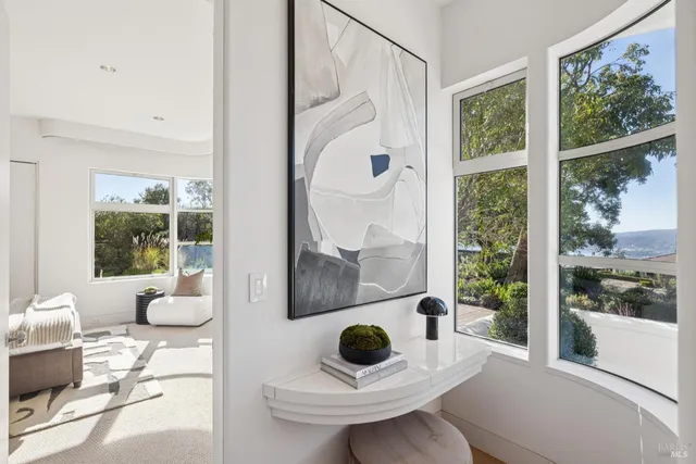 a bathroom with a granite countertop double vanity and a mirror