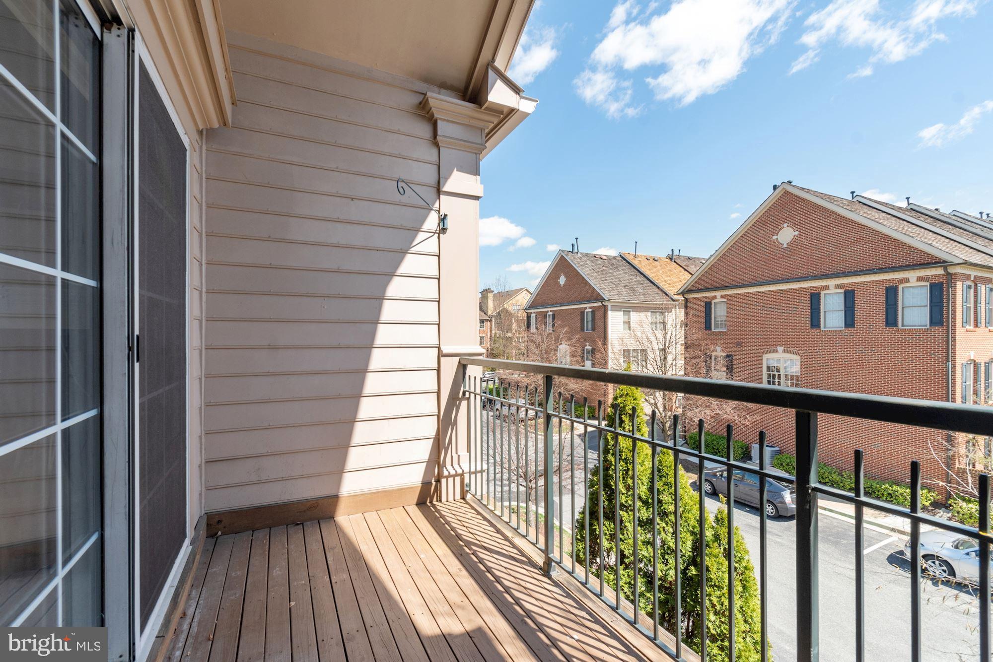 304 Ridgepoint Place, Unit 32 Gaithersburg, MD 20878 - Photo 8 of 28 a view of a balcony with wooden floor