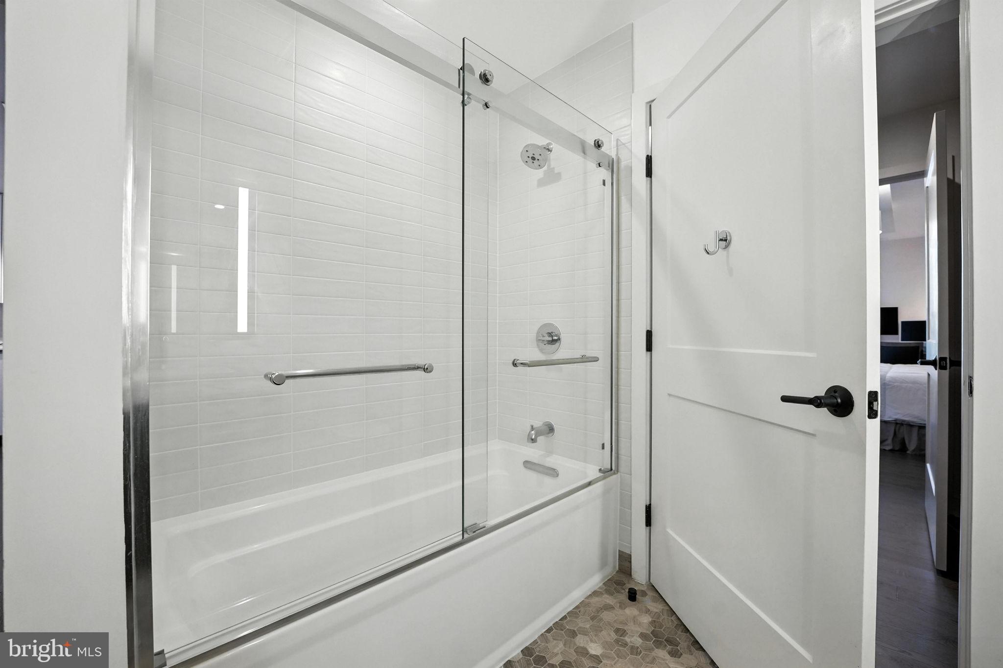 70 N Street Southeast, Unit N913 Washington, DC 20003 - Photo 16 of 60 a bathroom with a shower and a bath tub