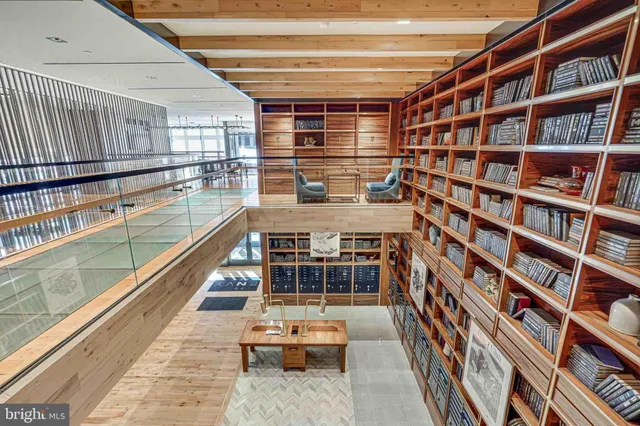 a balcony with furniture and book shelf