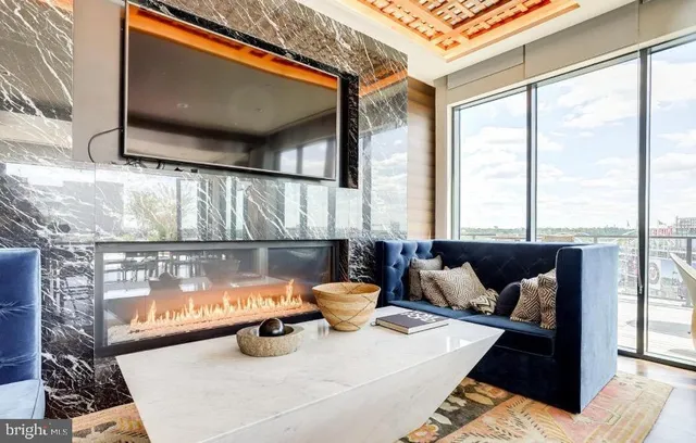 a view of a patio with dining table and chairs with a fire pit