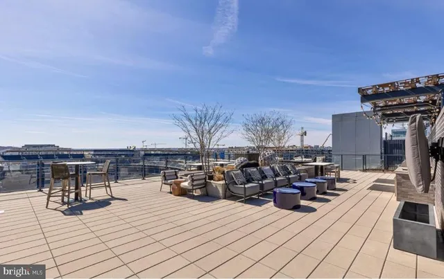 a view of a patio filled with furniture
