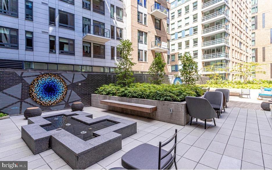 70 N Street Southeast, Unit N913 Washington, DC 20003 - Photo 49 of 60 a view of a patio filled with furniture