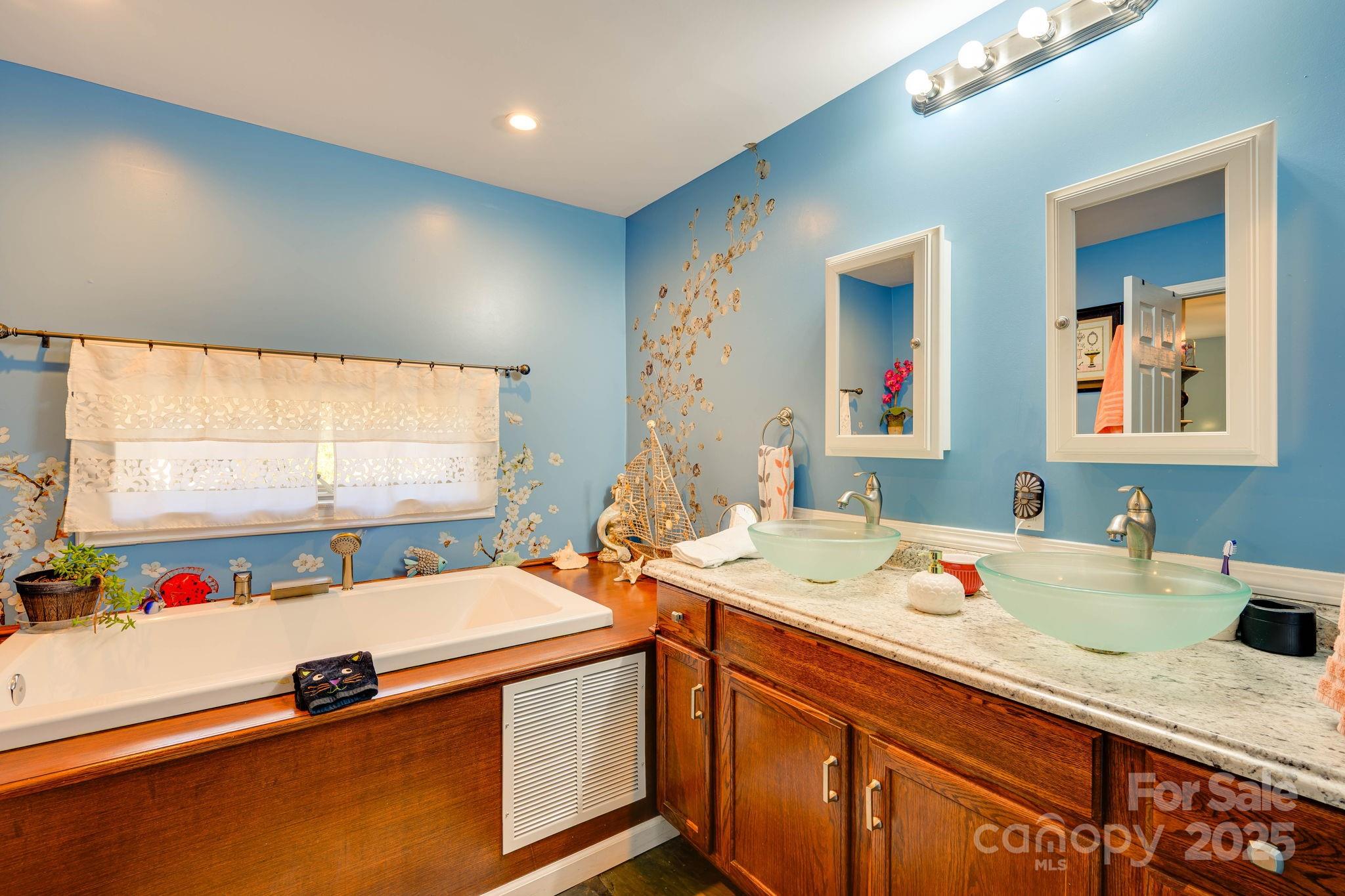 1390 Piney Knob Road Rutherfordton, NC 28139 - Photo 15 of 31 a bathroom with a granite countertop sink and a large mirror