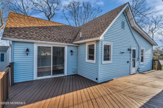 a view of a house with wooden deck