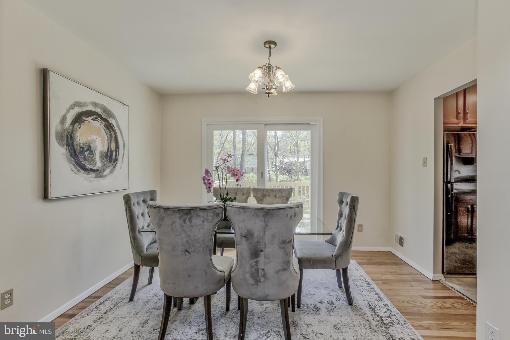 14112 Flint Rock Road Rockville, MD 20853 - Photo 11 of 52 a view of a dining room with furniture window and wooden floor
