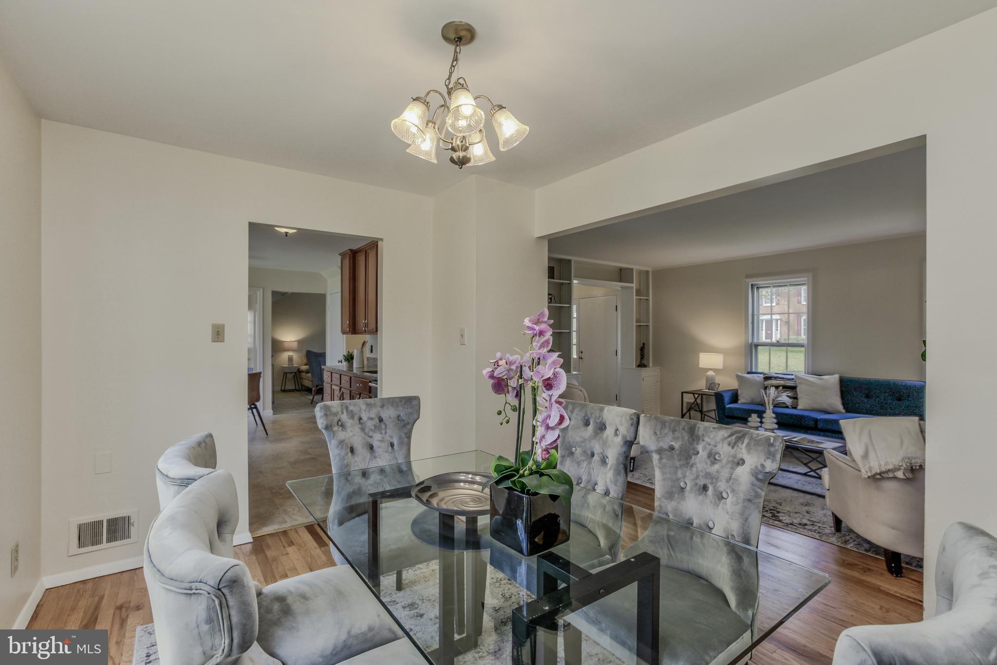 14112 Flint Rock Road Rockville, MD 20853 - Photo 13 of 52 a view of a dining room with furniture and chandelier