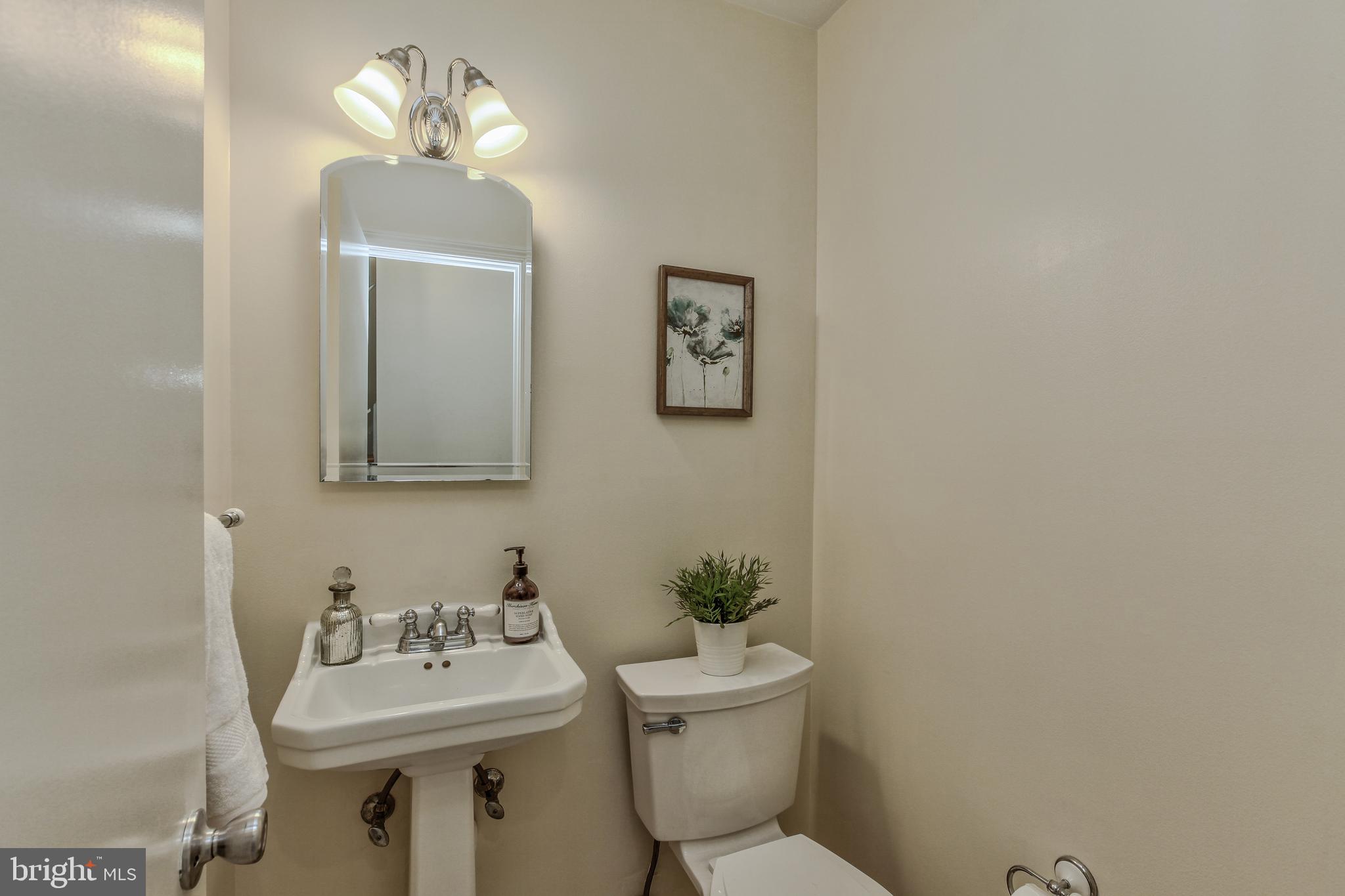 14112 Flint Rock Road Rockville, MD 20853 - Photo 24 of 52 a bathroom with a toilet sink and mirror
