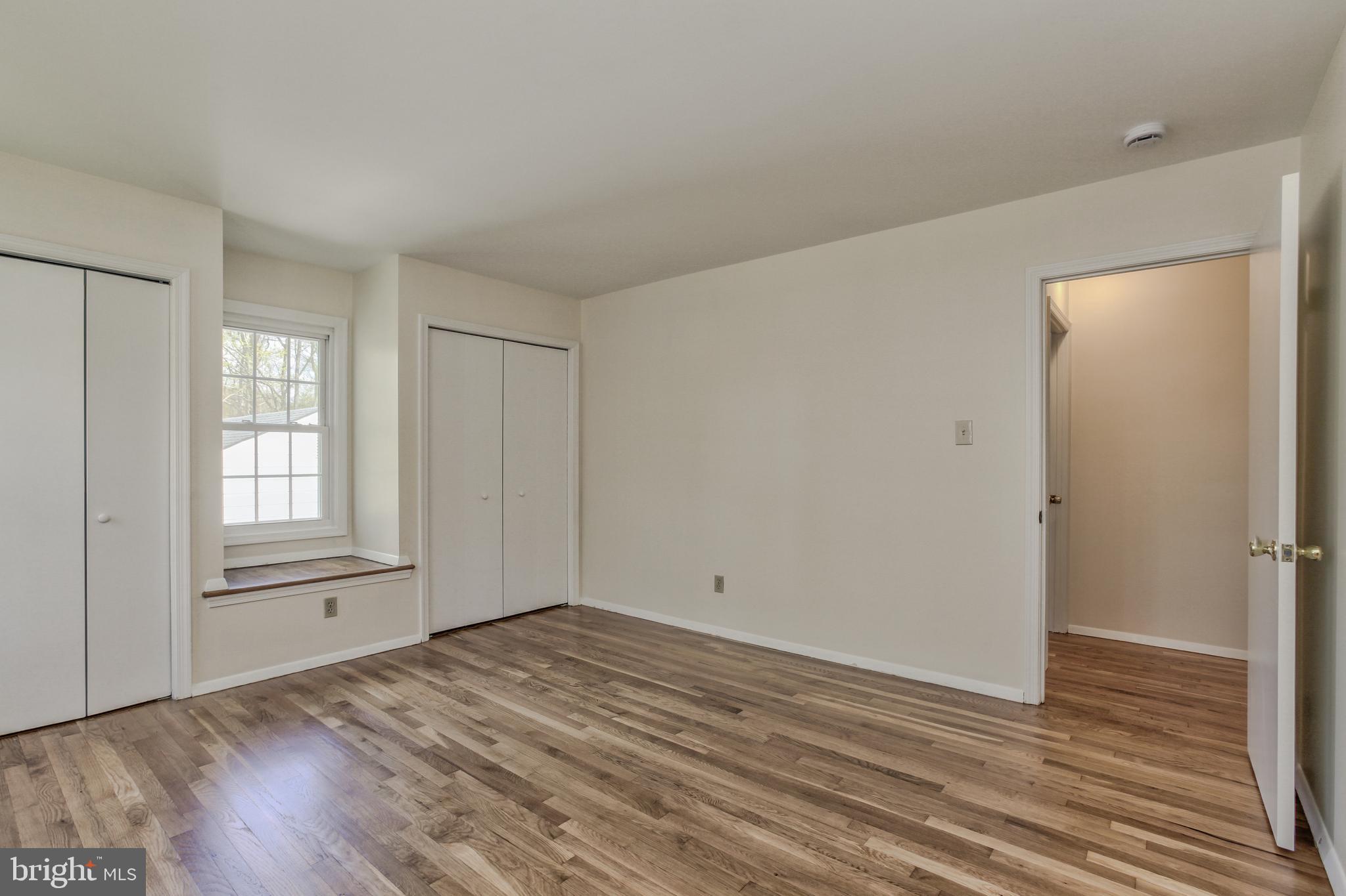 14112 Flint Rock Road Rockville, MD 20853 - Photo 31 of 52 a view of empty room with wooden floor and fan