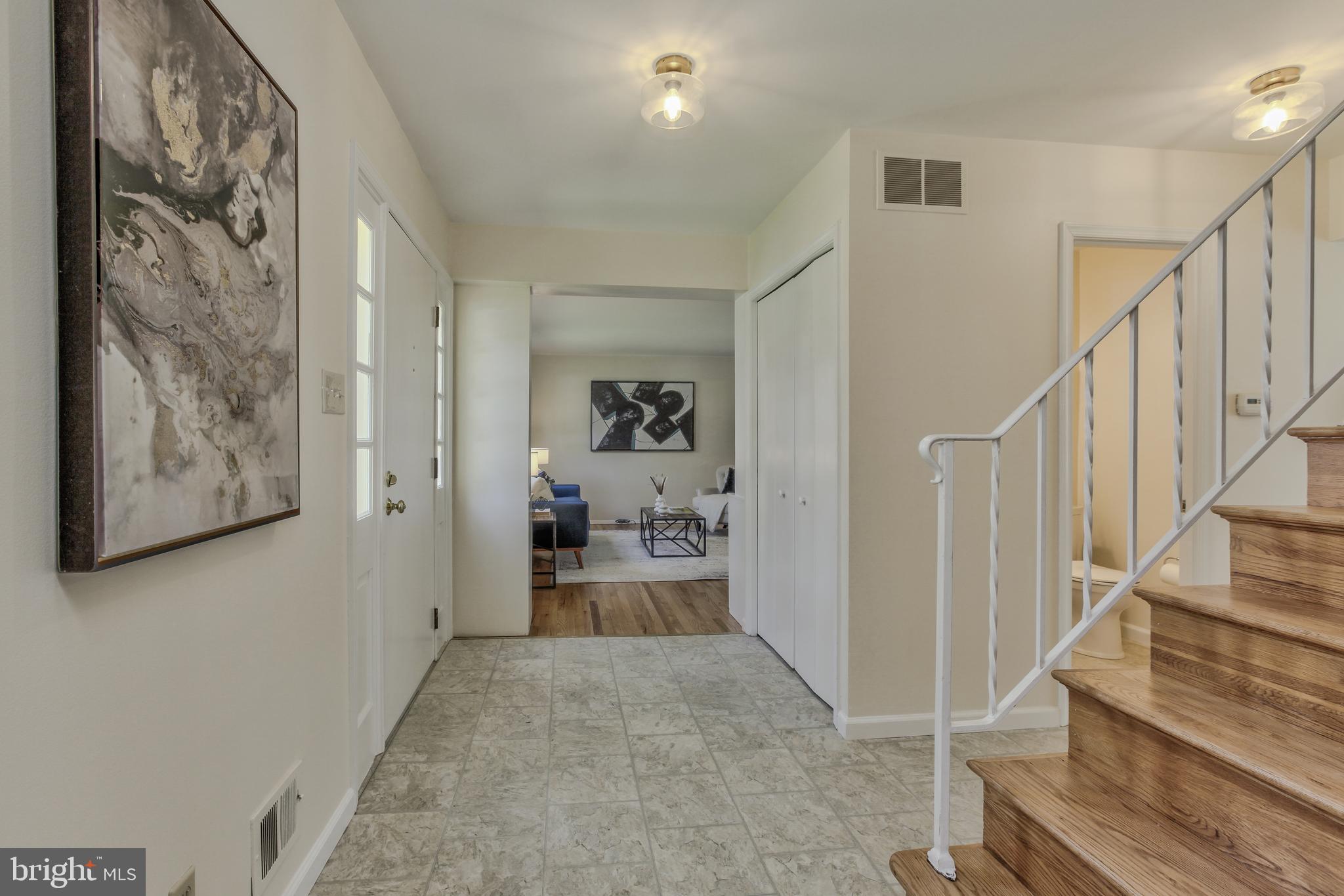 14112 Flint Rock Road Rockville, MD 20853 - Photo 4 of 52 a view of a hallway with wooden floor and entryway