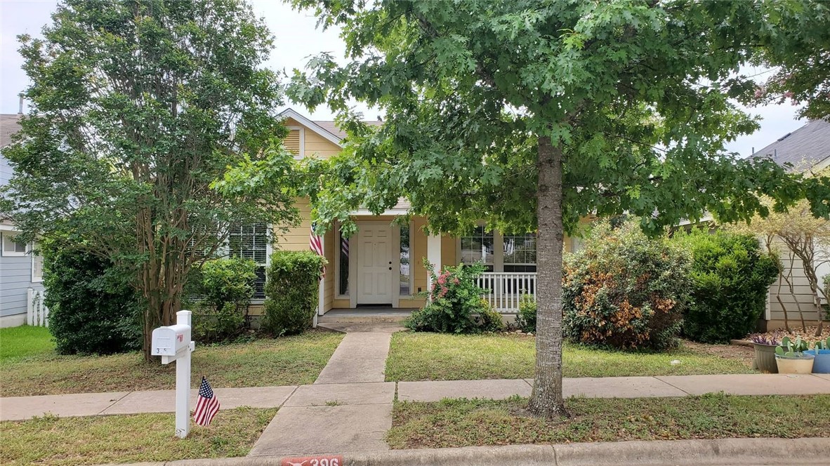 396 Sampson Kyle, TX 78640 - Photo 1 of 1 a front view of a house with a yard and tree