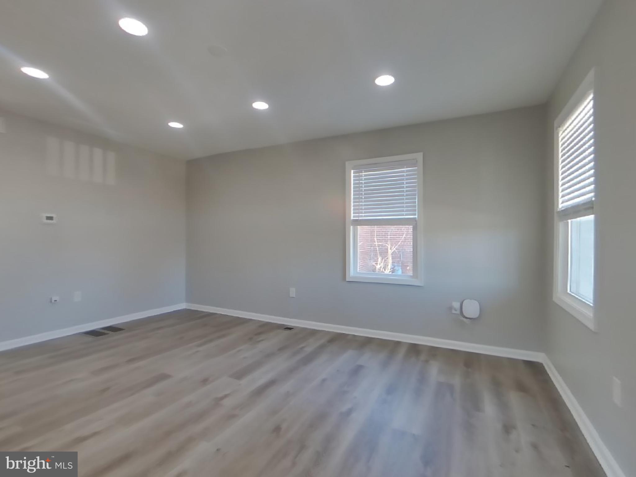 4217 Vine Street Capitol Heights, MD 20743 - Photo 4 of 15 an empty room with wooden floor and windows