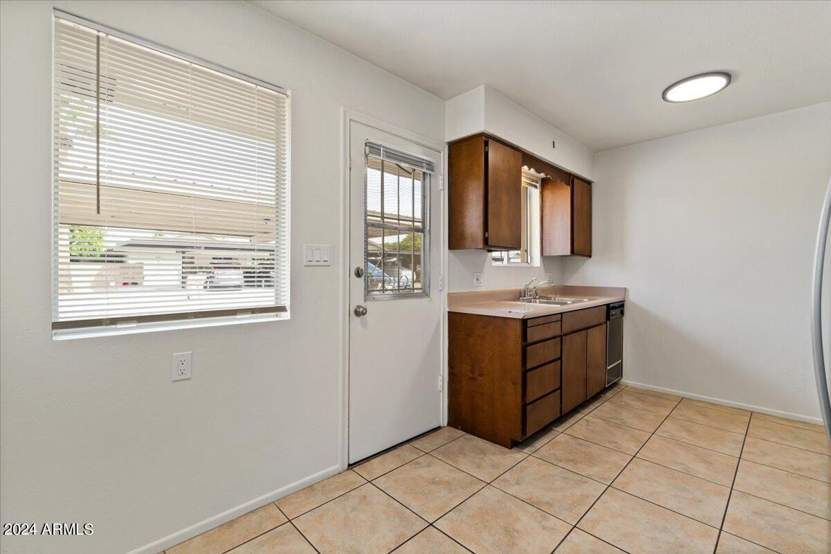 6438 East Butte Street, Unit 2 Mesa, AZ 85205 - Photo 11 of 27 a bathroom with a sink vanity and a mirror