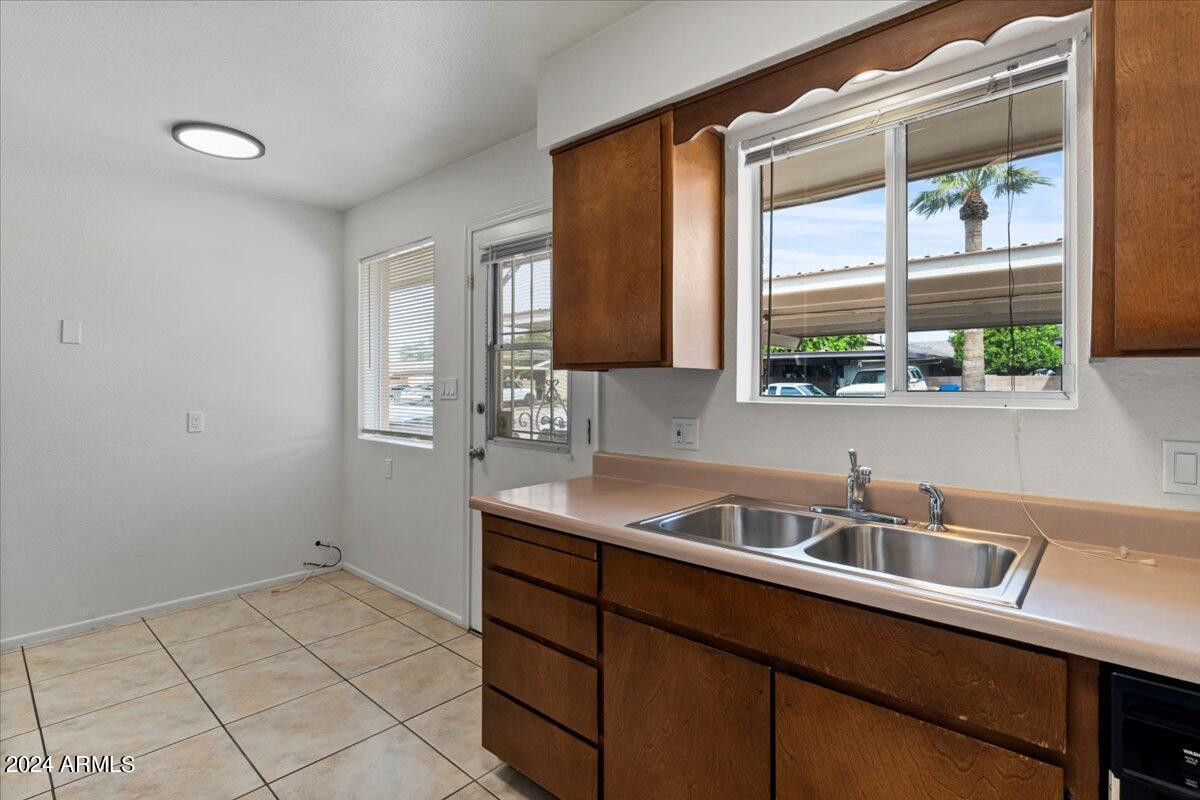 6438 East Butte Street, Unit 2 Mesa, AZ 85205 - Photo 14 of 27 a kitchen that has a sink and a window