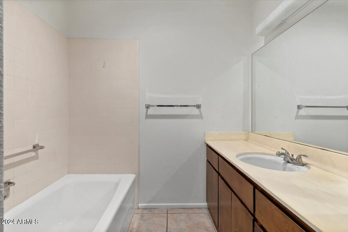 6438 East Butte Street, Unit 2 Mesa, AZ 85205 - Photo 19 of 27 a bathroom with a sink and a bathtub