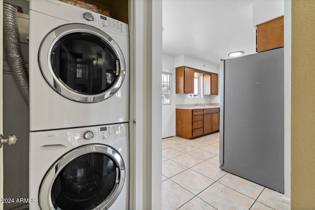 6438 East Butte Street, Unit 2 Mesa, AZ 85205 - Photo 20 of 27 a view of a kitchen with washer and dryer