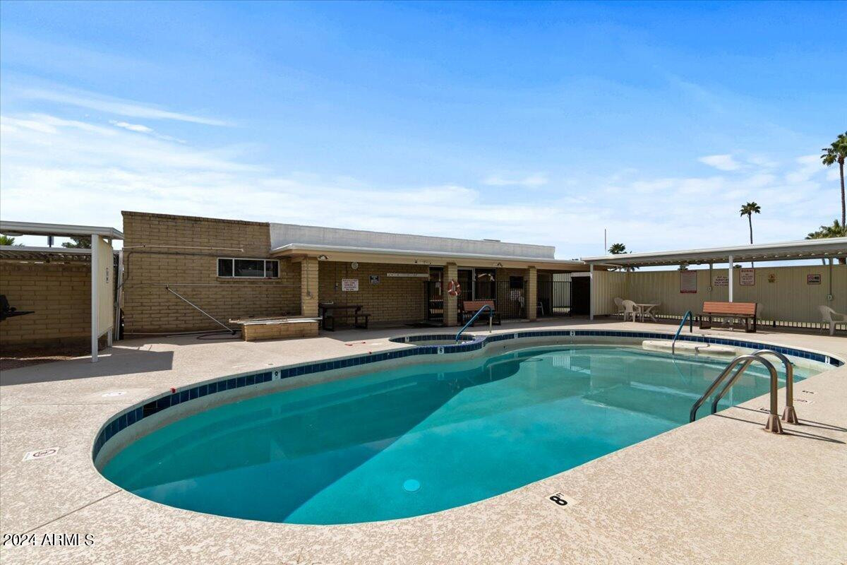 6438 East Butte Street, Unit 2 Mesa, AZ 85205 - Photo 23 of 27 a view of a swimming pool with a patio