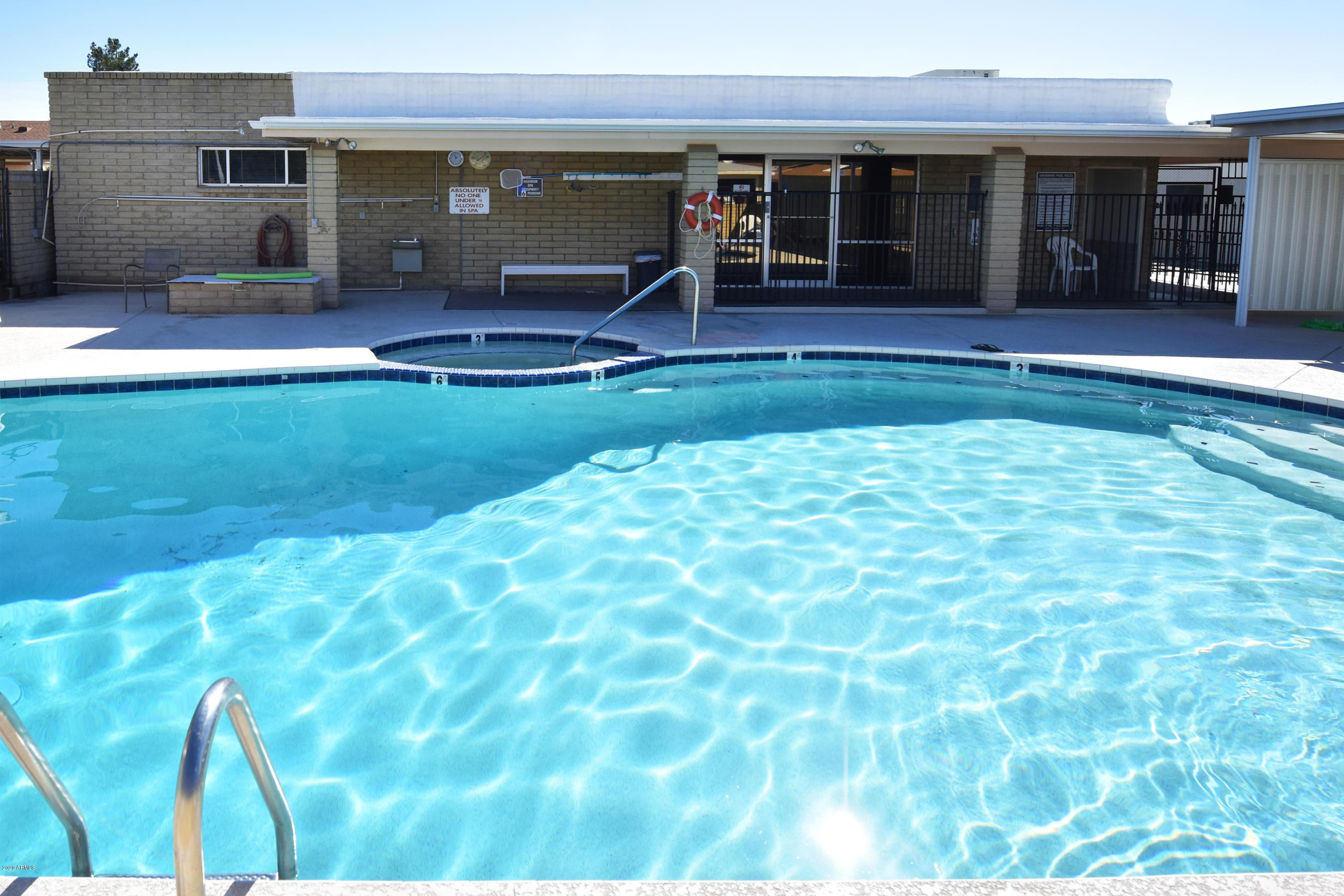6438 East Butte Street, Unit 2 Mesa, AZ 85205 - Photo 24 of 27 a view of front a house with a yard