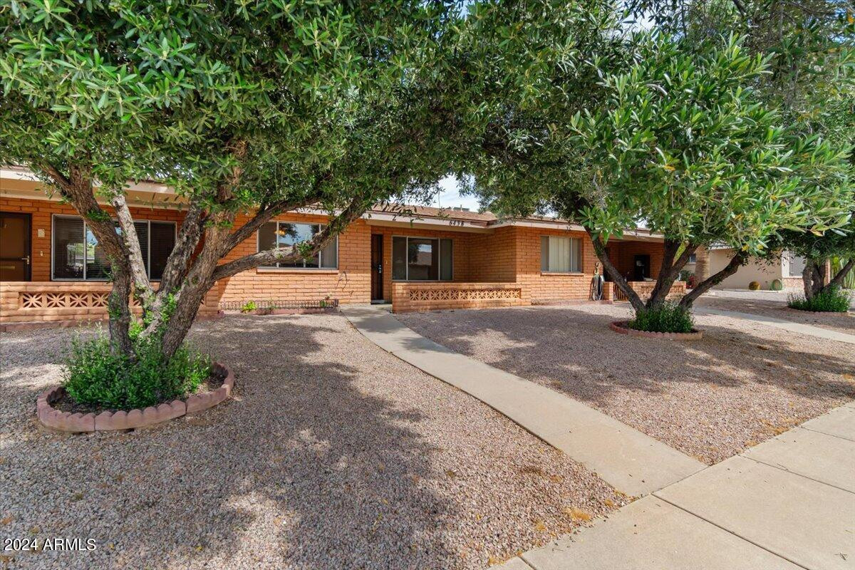 6438 East Butte Street, Unit 2 Mesa, AZ 85205 - Photo 3 of 27 a view of a house with a patio