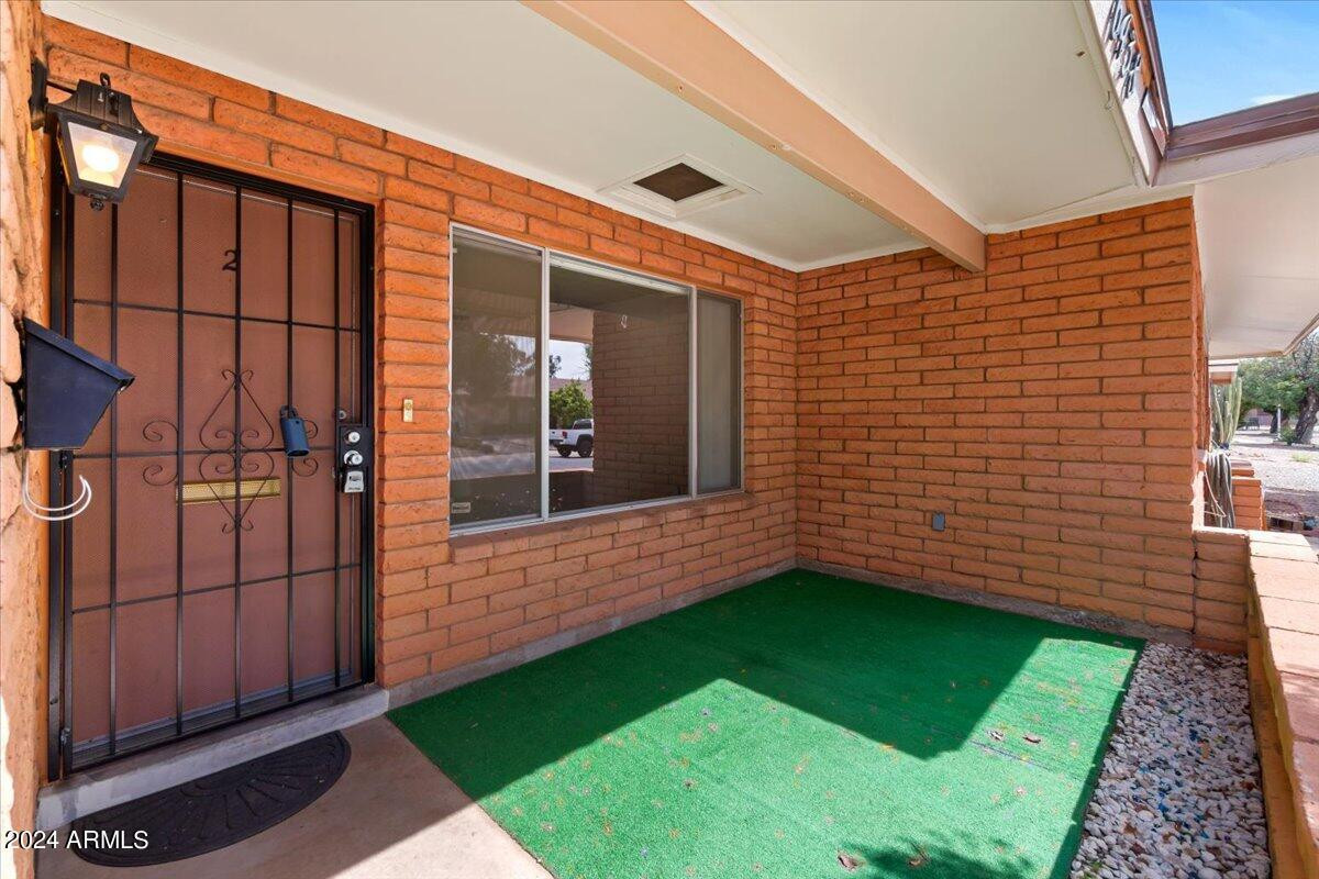 6438 East Butte Street, Unit 2 Mesa, AZ 85205 - Photo 6 of 27 a view of a backyard with potted plants