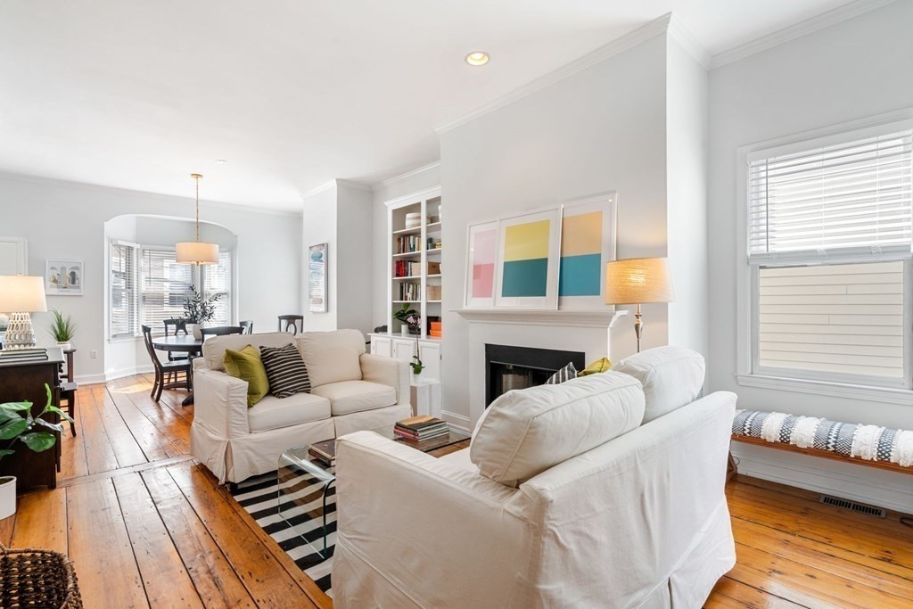 40 Pearl Street, Unit 2 Boston, MA 02129 - Photo 1 of 13 a living room with furniture a fireplace and a large window