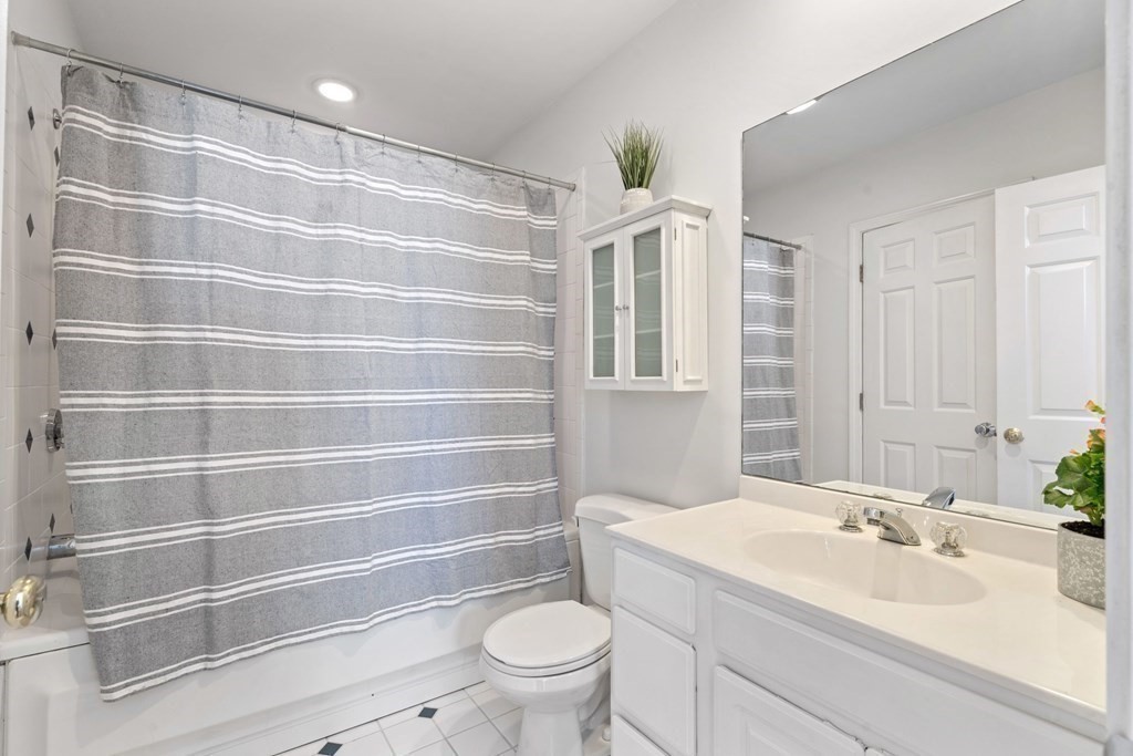 40 Pearl Street, Unit 2 Boston, MA 02129 - Photo 11 of 13 a bathroom with a sink toilet and shower