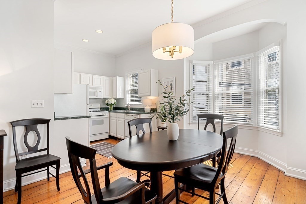 40 Pearl Street, Unit 2 Boston, MA 02129 - Photo 4 of 13 a view of a dining room with furniture window and wooden floor