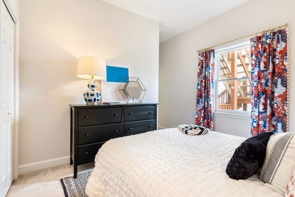 40 Pearl Street, Unit 2 Boston, MA 02129 - Photo 8 of 13 a bedroom with a bed and a window