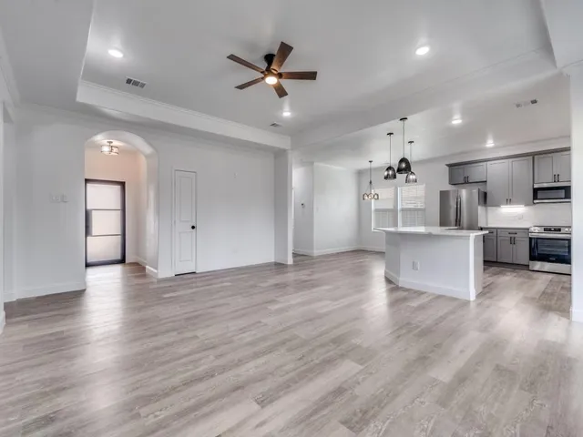 a view of kitchen with wooden floor