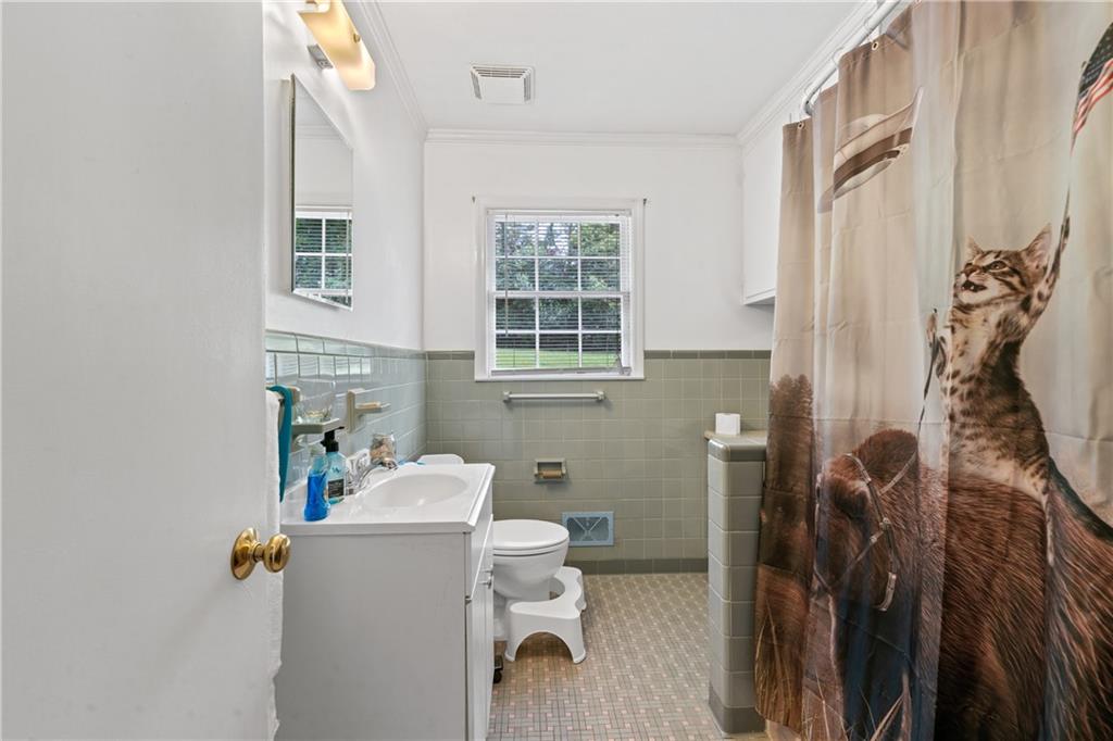 3061 General Lee Road Macon, GA 31204 - Photo 13 of 27 a bathroom with a sink toilet and shower