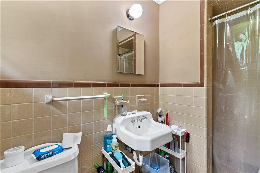 3061 General Lee Road Macon, GA 31204 - Photo 17 of 27 a bathroom with a sink toilet and a mirror