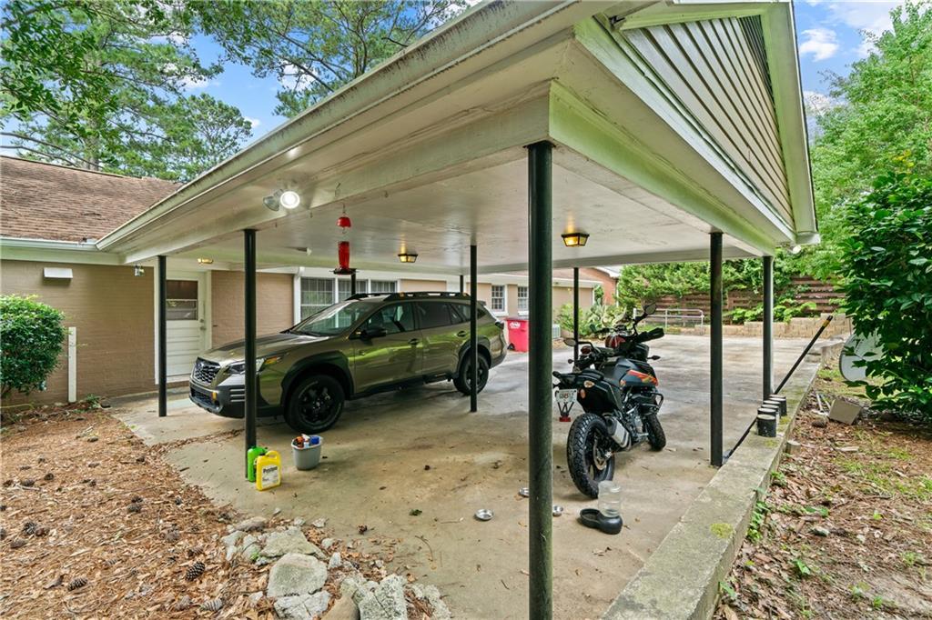 3061 General Lee Road Macon, GA 31204 - Photo 21 of 27 a view of a patio with table and chairs under an umbrella