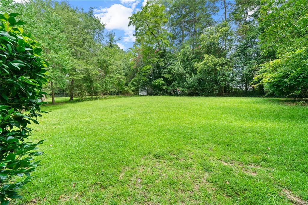 3061 General Lee Road Macon, GA 31204 - Photo 22 of 27 a view of a green field with trees in the background