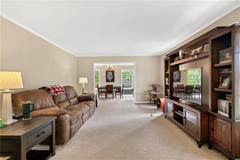 3061 General Lee Road Macon, GA 31204 - Photo 6 of 27 a living room with furniture and a flat screen tv