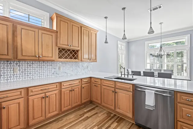 a kitchen with sink cabinets and window